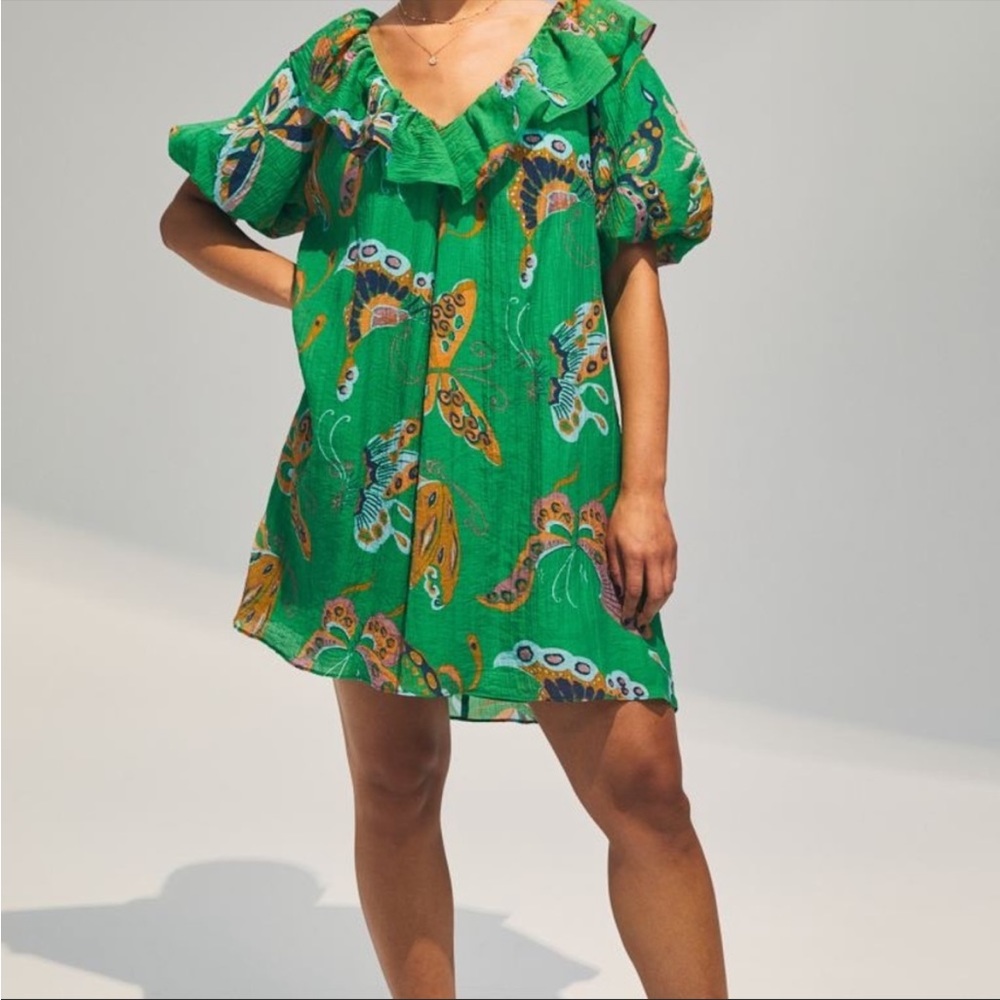 Beautiful green dress with butterflies. New with tags. H&M size small.